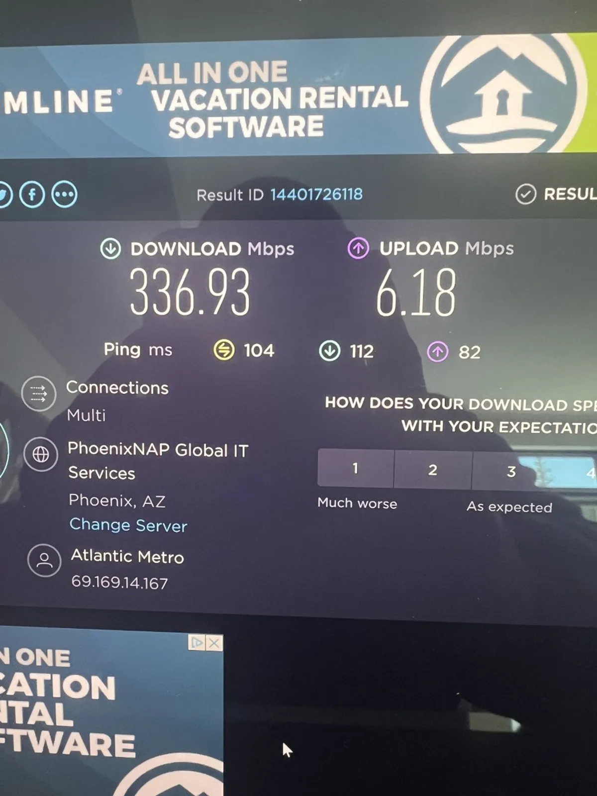 This image shows internet speed test results, vacation rental branding, and a clean workspace setting. It communicates efficient, seamless online experiences necessary for remote work, video conferencing, and streaming.